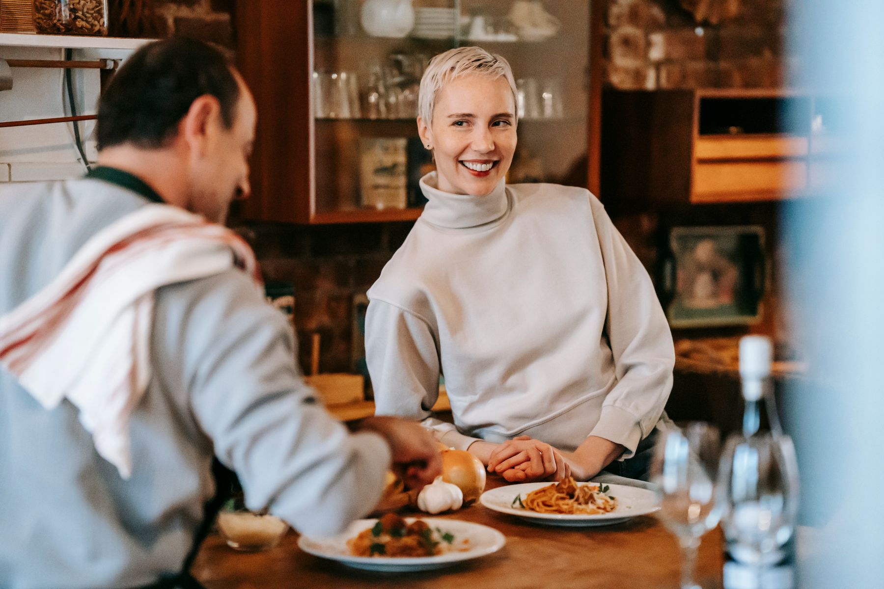 A couple enjoying pasta together