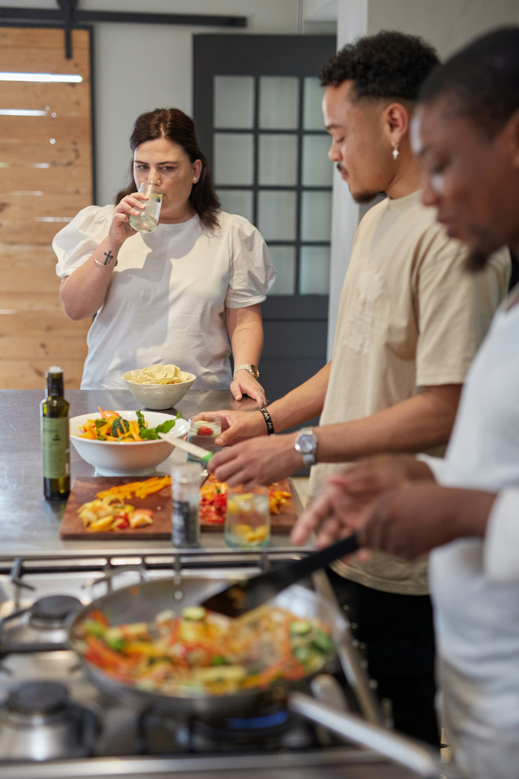 Friends preparing food in a home kitchen